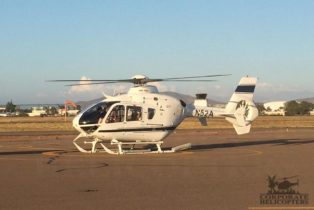 A 1999 Eurocopter EC135T1 helicopter on an airfield