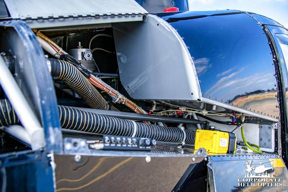 Partial shot of exposed engine of a 2006 Robinson R44 Raven II helicopter