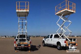 2 photos of an extended Scissor Lift on a 2008 F350XL Truck