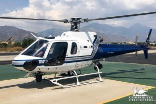 2011 Eurocopter AS350 B2 helicopter landed on an airfield