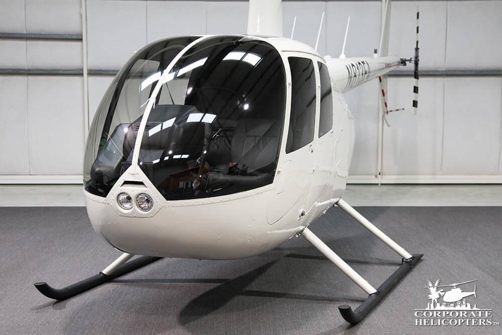 2019 Robinson R44 Raven I from the front. It is parked in a hangar