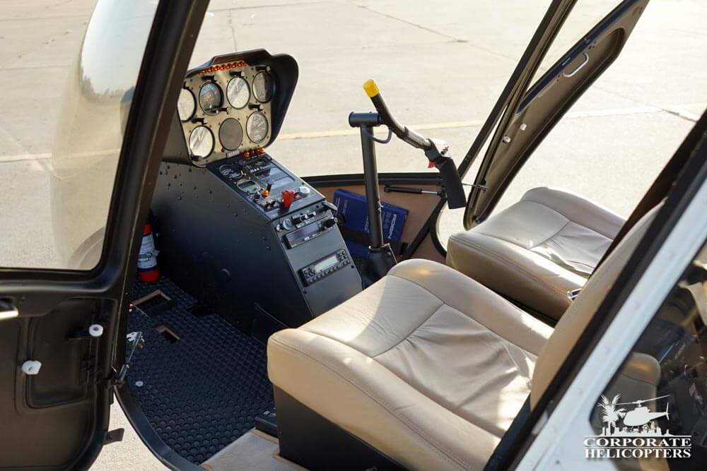 Front seats and flight controls of a 2013 Robinson R44 Raven I helicopter