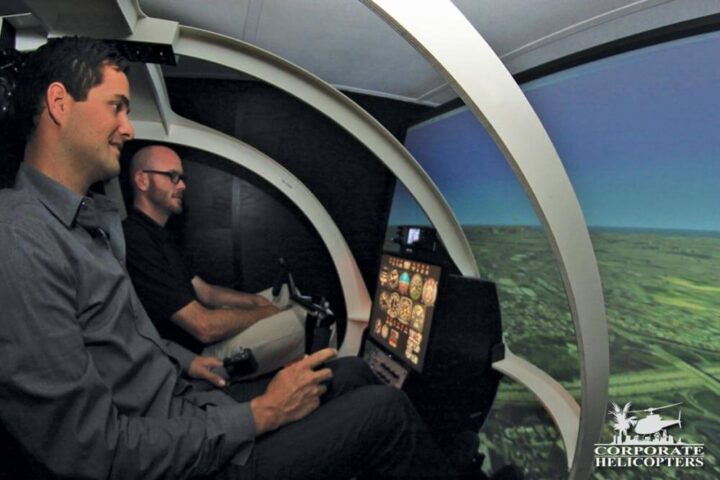 Student and instructor inside a helicopter flight simulator