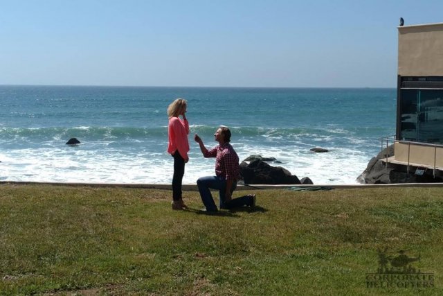 Man proposes to woman on one knee at Punta Morro Resort in Ensenada, Mexico