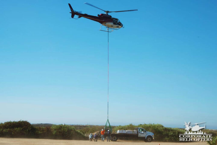 Helicopter lifting an External Load from the back of a truck