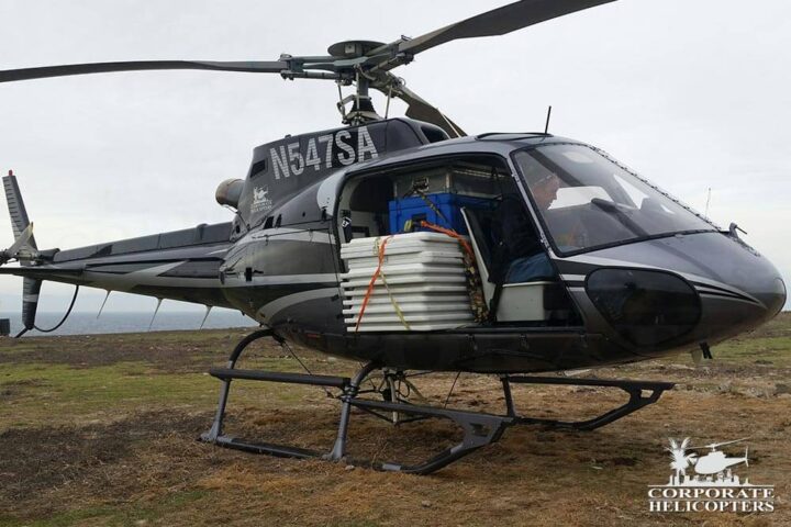 Corporate Helicopters helicopter loaded with supplies on Todos Santos