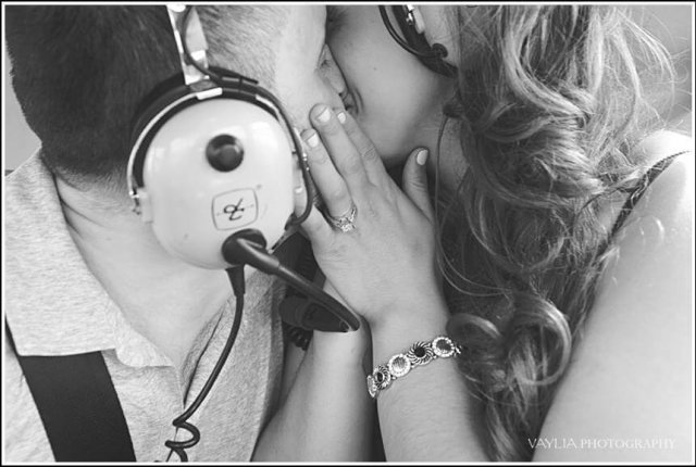 A couple kisses during a marriage proposal on a helicopter (Photo credit: Vaylia Photography)
