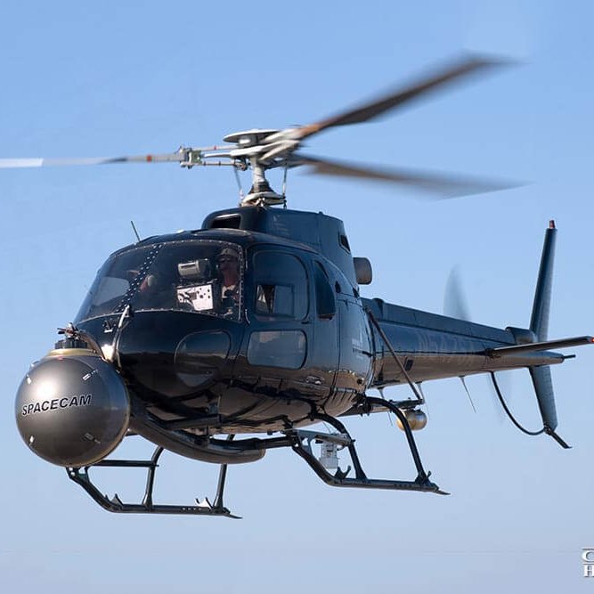 Helicopter in-flight with camera equipment on the nose