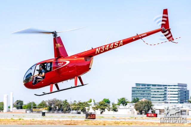 Robinson R44 with the door off, the helicopter has taken off