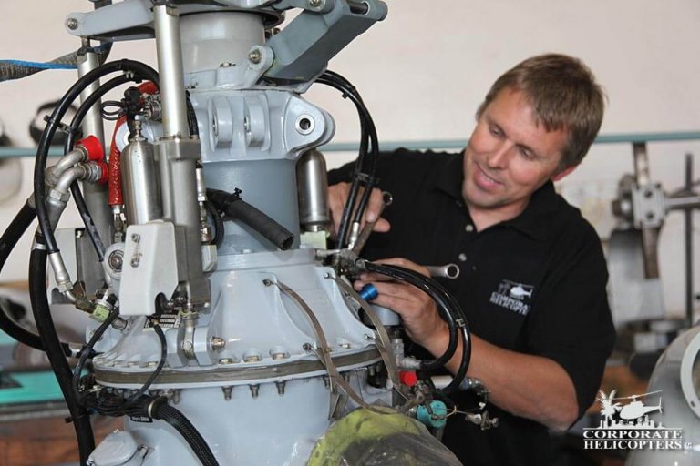 A&P Mechanic works on a helicopter