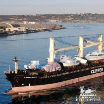 Aerial view of a ship sailing through San Diego Bay.
