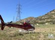 Helicopter landed next to powerlines