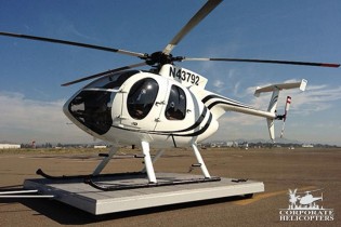 2010 McDonnell Douglas MD 500E helicopter on a platform