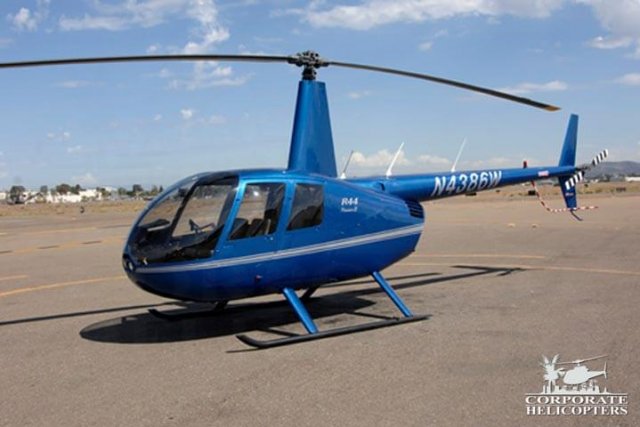 2009 Robinson R44 Raven II helicopter on an airfield