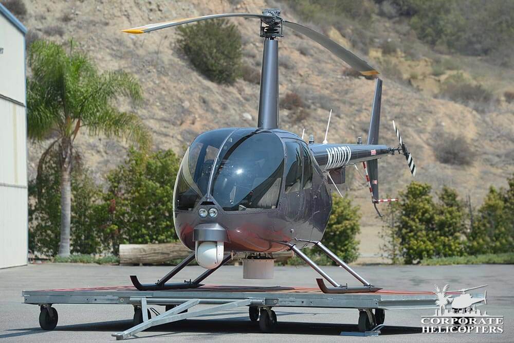 2012 Robinson R44 Raven II helicopter Newscopter on a platform