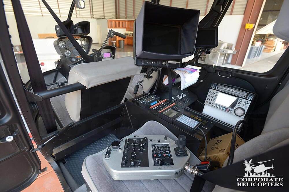 Specialized newscopter equipment in the back seat of a 2012 Robinson R44 Raven II helicopter