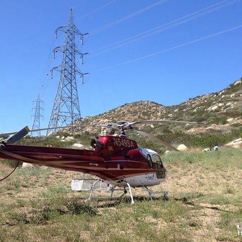 Helicopter landed next to powerlines
