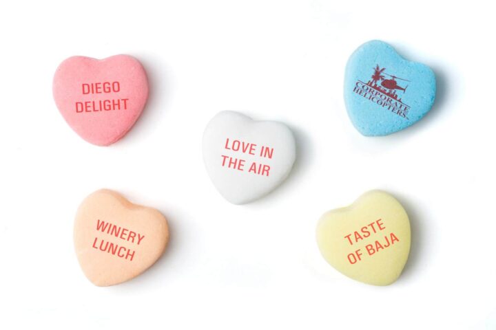 Candy hearts read the names of tours from Corporate Helicopters: Diego Delight, WInery Lunch, Love in the Air, Taste of Baja