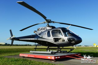 2011 Eurocopter AS350 B2 helicopter landed on a platform in a field