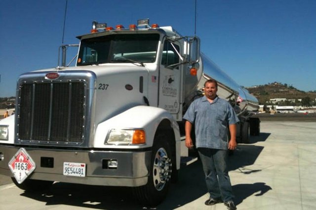 Man next to Fuel tanker