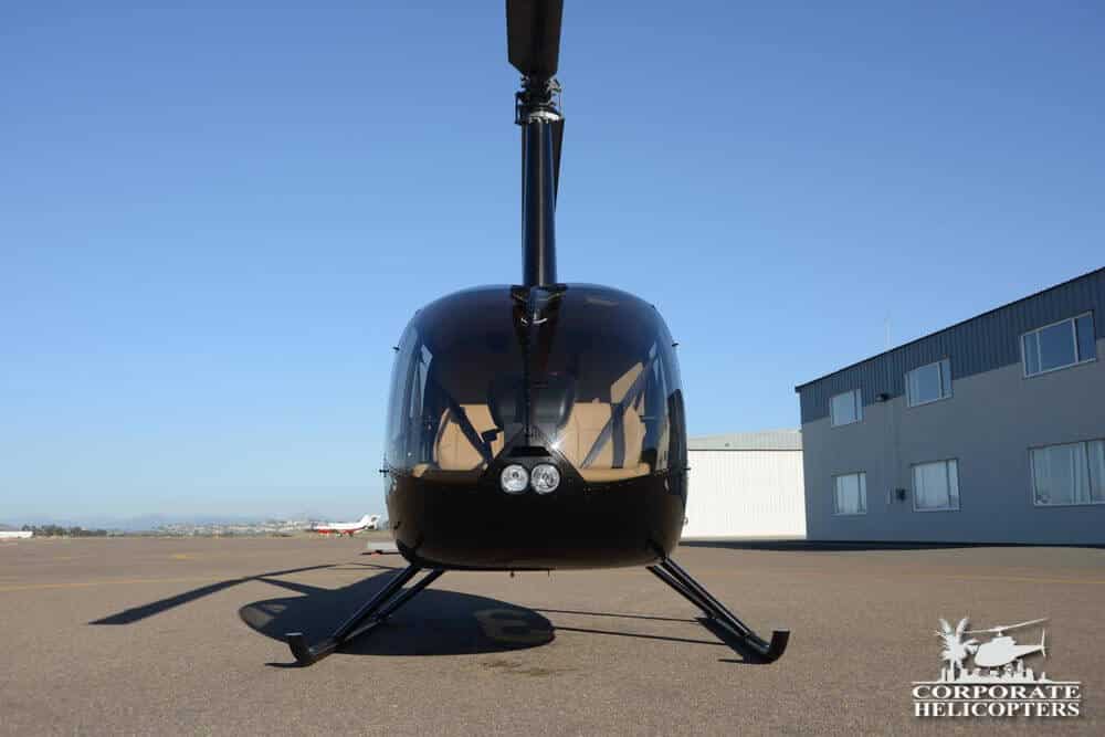 Front view of a 2014 Robinson R66 Turbine helcicopter on the ground