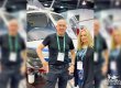 Ivor and Deann Shier stand in front of a helicopter at the 2020 HAI HELI-EXPO.