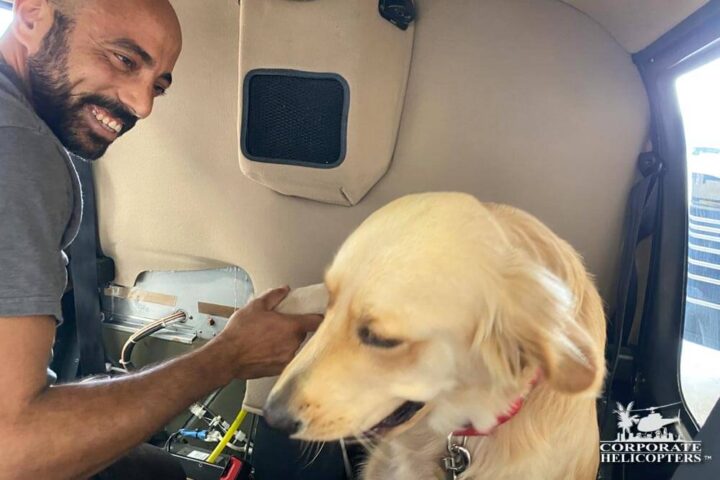 Louie the dog inside of a helicopter with his owner Osama
