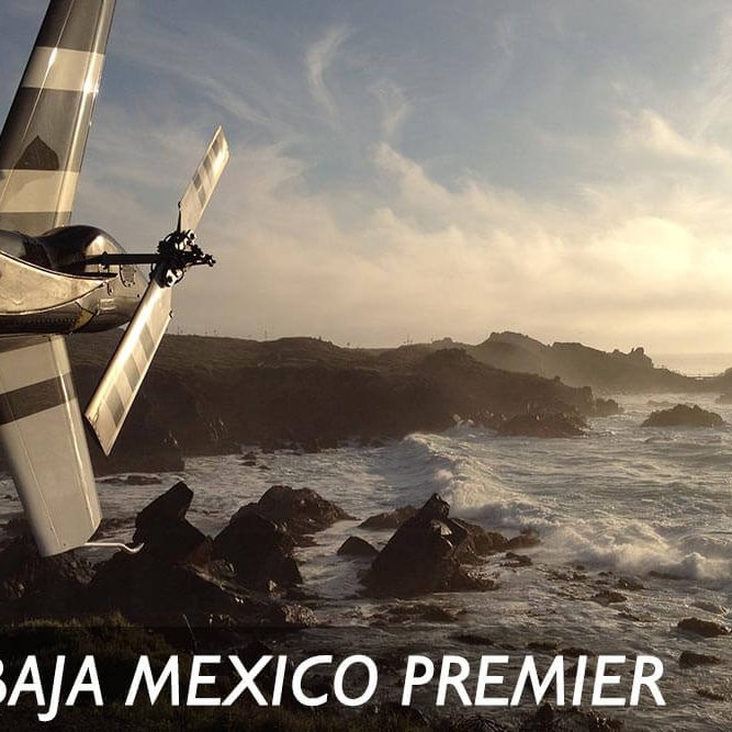 Helicopter tail in front of Mexican coastline. Text reads: Baja Mexico Premier