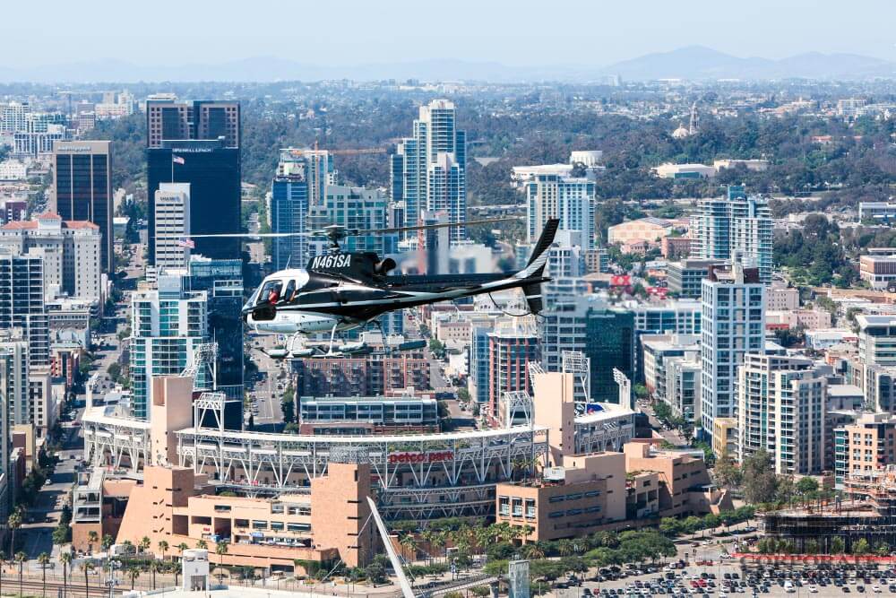 Helicopter flies next to Petco Park, downtown San Diego.