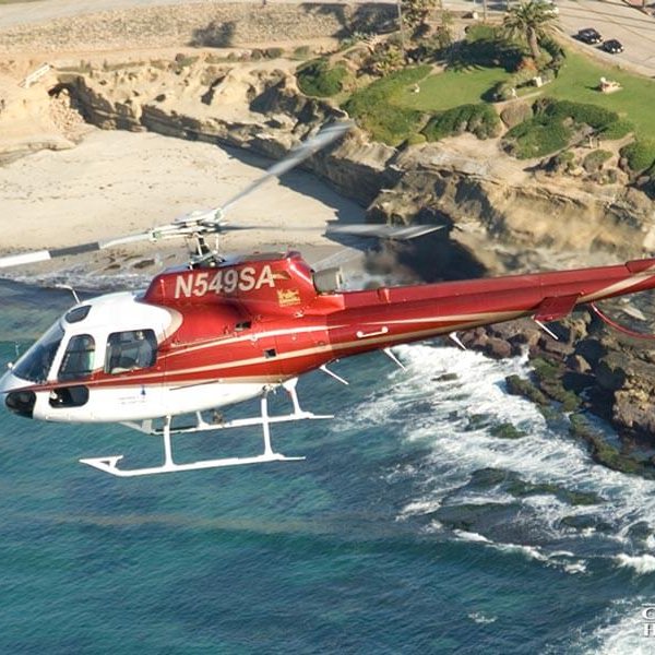 Helicopter flying over coastline in La Jolla
