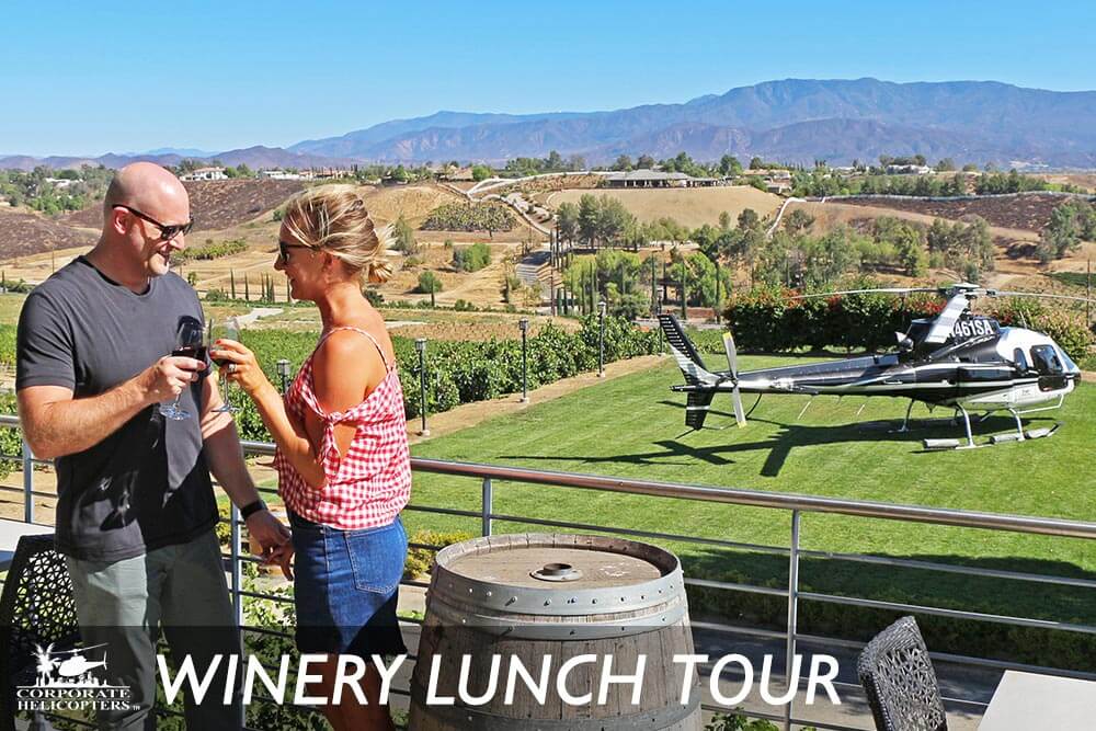 Couple drinking wine at Callaway Winery, helicopter in background. Text reads: Winery Lunch Tour