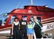 Irish Santa, a female elf, Ivor Shier, a boy pose in front of a helicopter