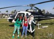 Irish Santa with elves in front of helicopter