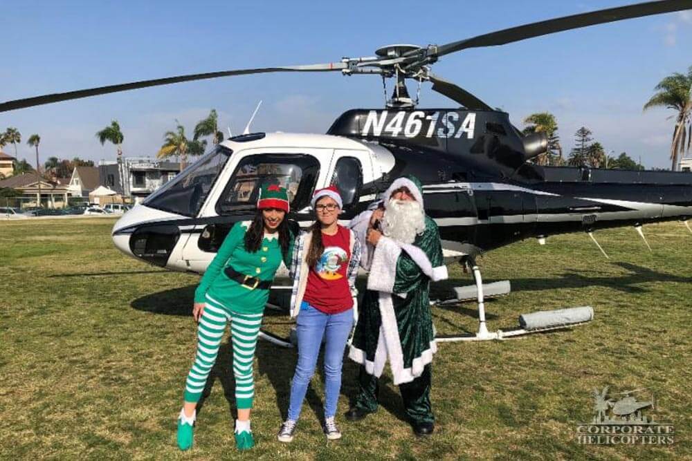 Irish Santa with elves in front of helicopter