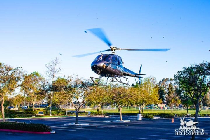 Helicopter Lift takes off in parking lot at Las Americas Mall