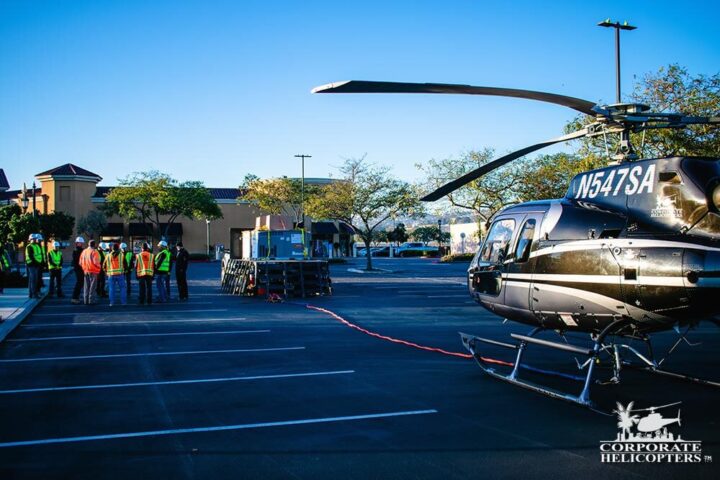 Helicopter Lift with a Long Line attached and crew at Las Americas Mall