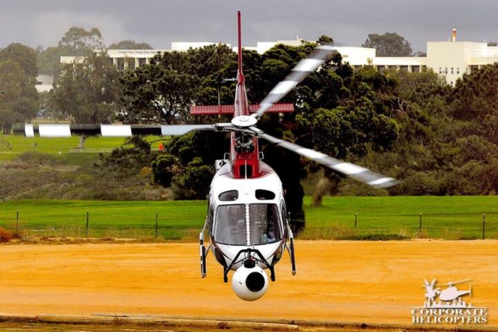 Helicopter with camera mounted on nose takes off