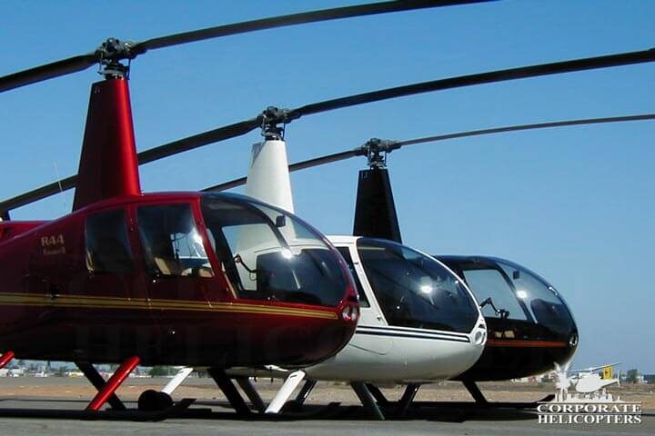 3 Robinson helicopters on an airfield
