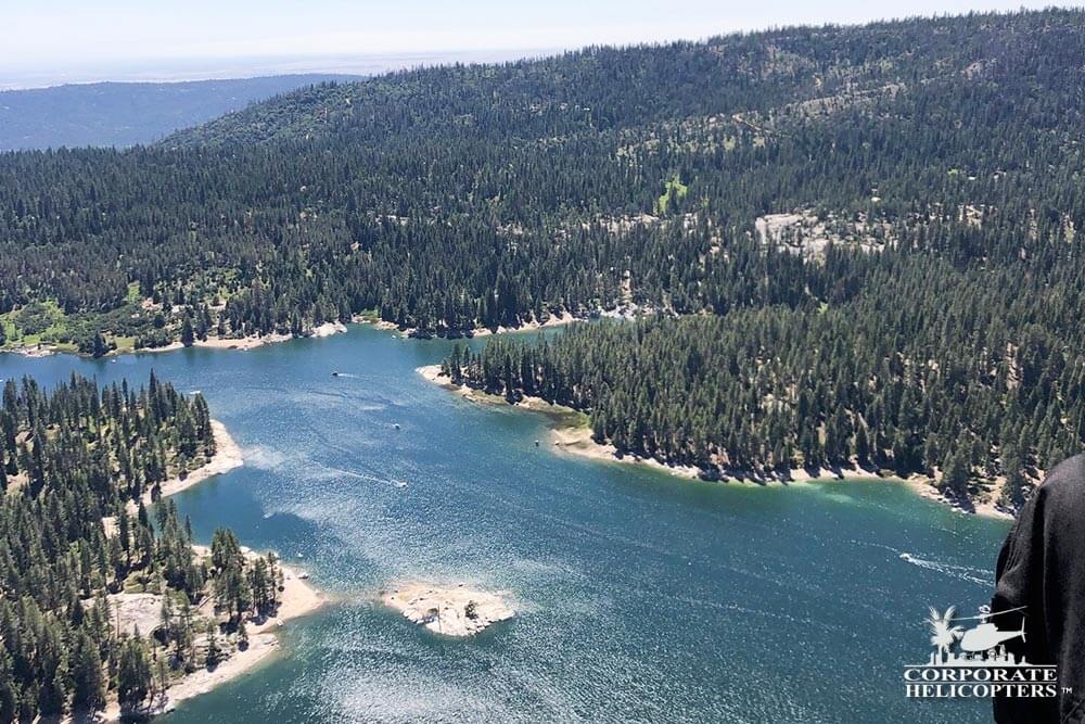 Aerial photo of mountain trees and a lake