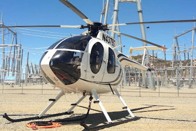 Helicopter landed next to power station