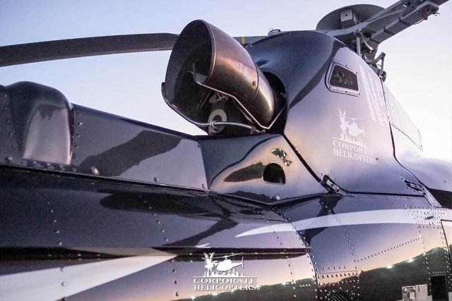 Helicopter vividly lit by sunset lighting.