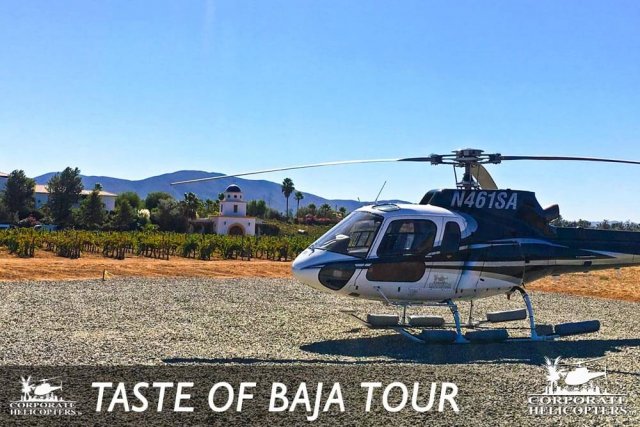 Helicopter landed near a vineyard. Text reads: Taste of Baja Tour
