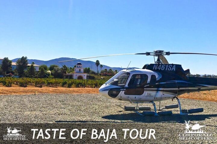 Helicopter landed near a vineyard. Text reads: Taste of Baja Tour