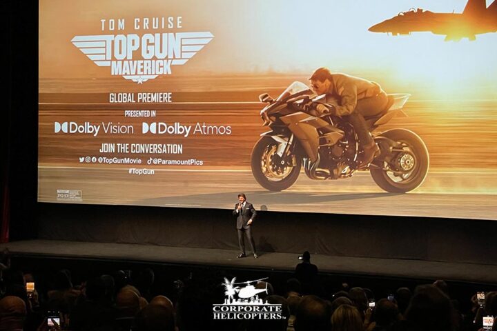 Tom Cruise speaking on stage at the Top Gun: Maverick world premiere