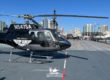 Corporate Helicopters' Airbus helicopter landed on the USS Midway for Top Gun Maverick premiere